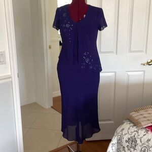 Purple special occasion dress. It has built in jacket beautifully decorated